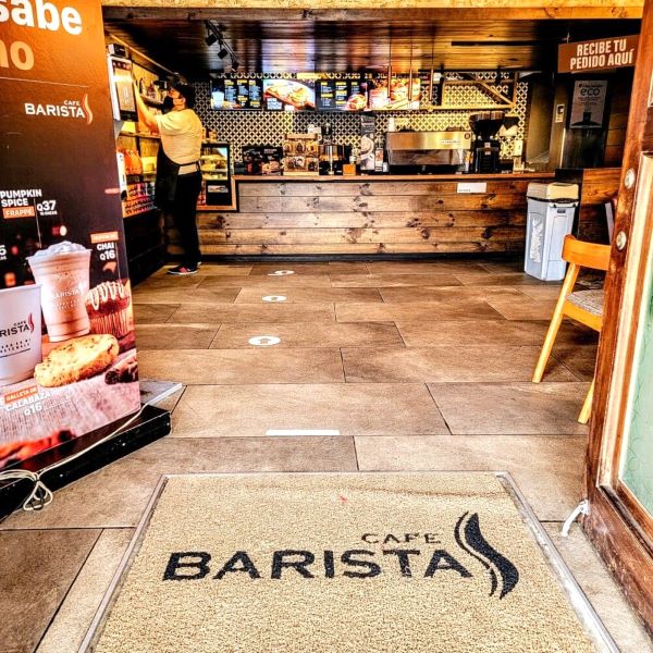 Barista inside entrance