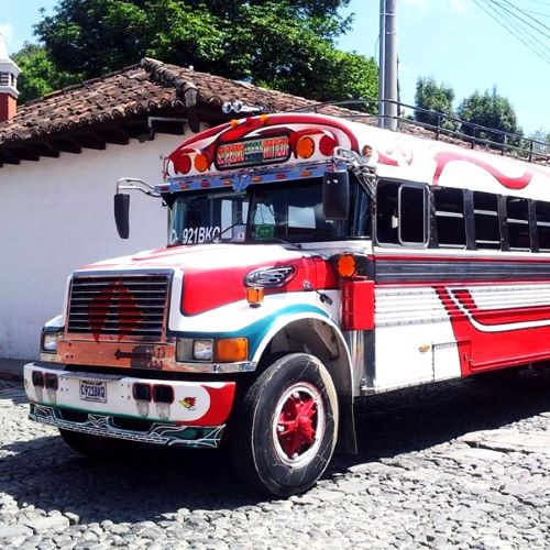 Photo of a Colorful Red and White Chicken Bus